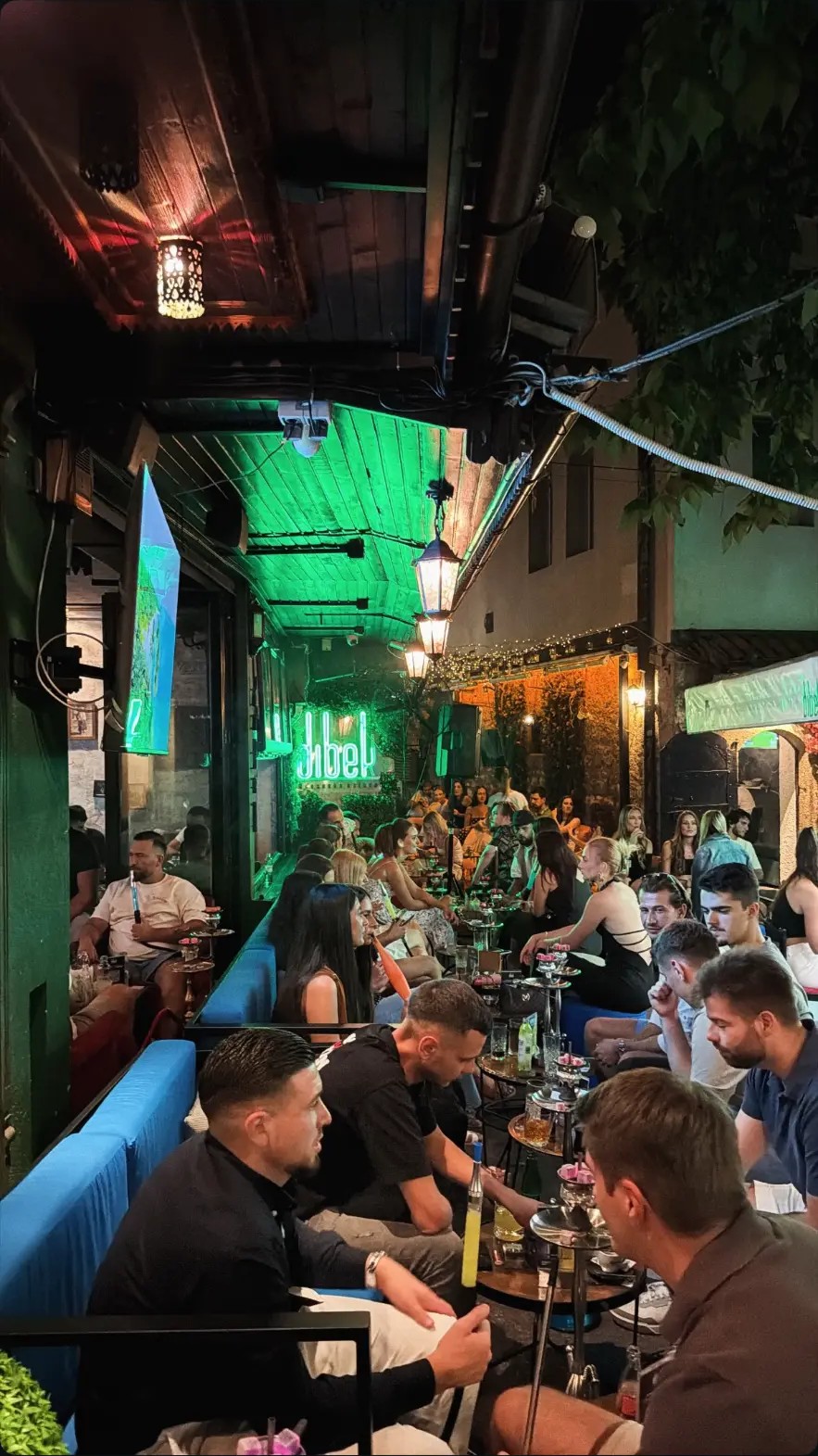 Neon-lit street terrace of Dibek in Baščaršija