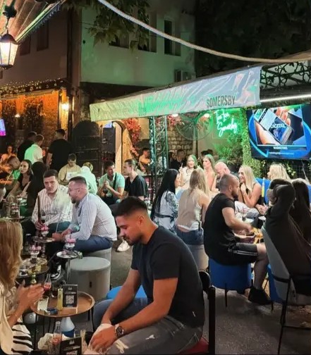 Lounge tables glowing under green light